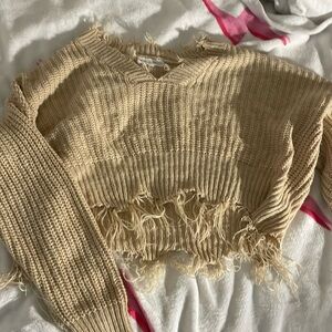 Tan sweater.